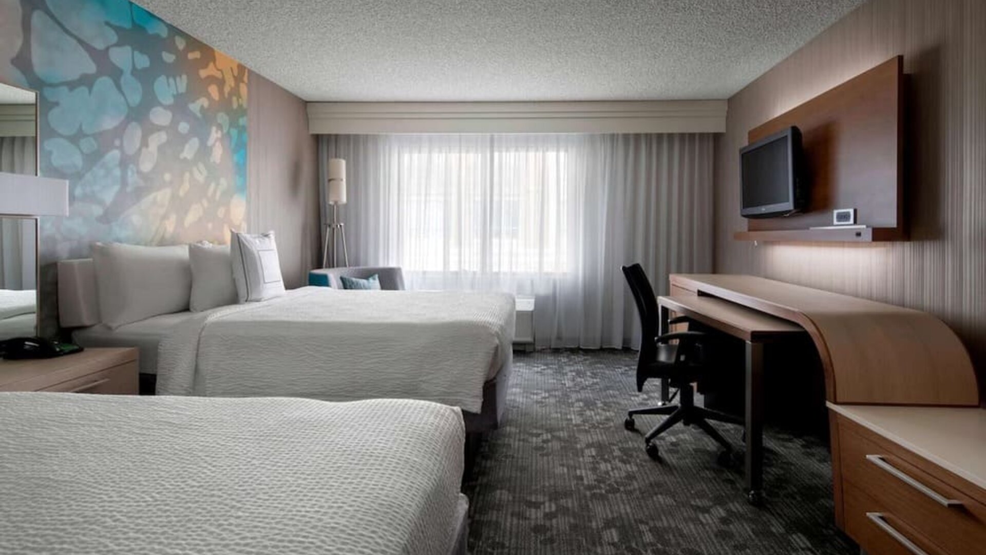 Bright and spacious day use twin room with work desk at Sonesta Select Tempe Downtown.
