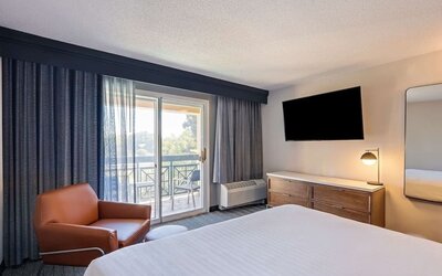 Bright and spacious day use room with balcony and work desk at Sonesta Select Pleasant Hill.