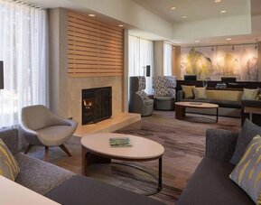 Lobby lounge with comfortable seating and fireplace at Sonesta Select Pleasant Hill.