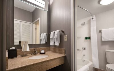 Private guest bathroom with free toiletries at Sonesta Select Phoenix Camelback.