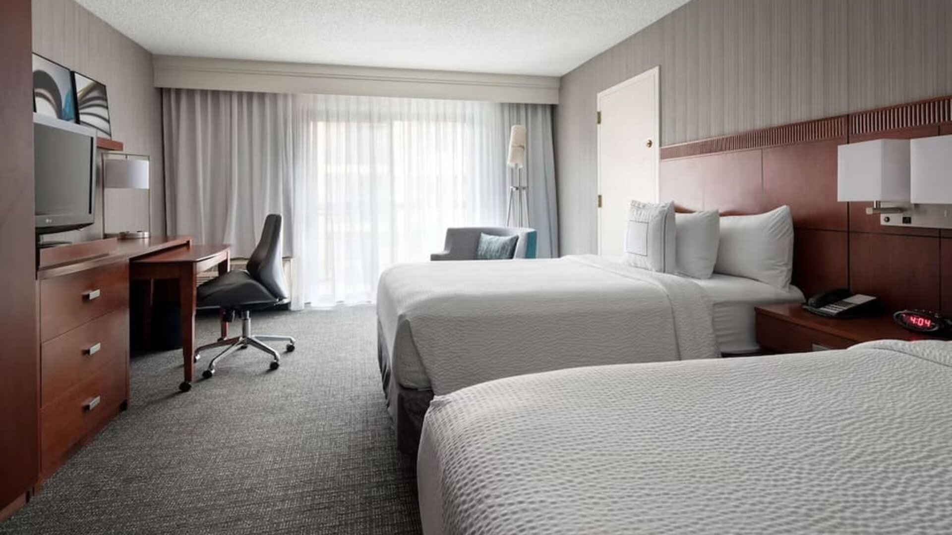 Bright and spacious day use twin room with work desk and floor to ceiling window at Sonesta Select Los Angeles LAX El Segundo.