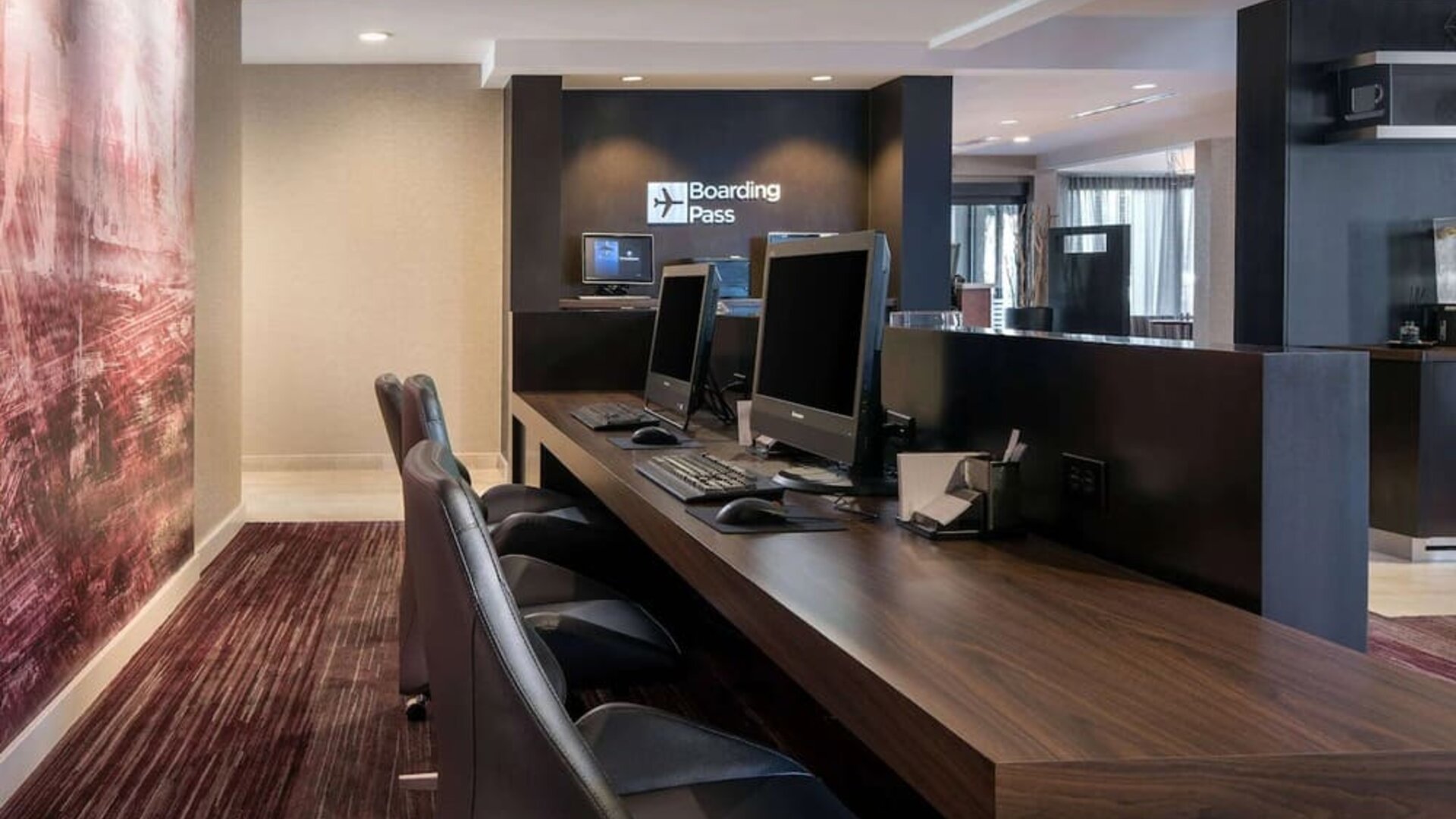 Business center with computers, printer and ergonomic chairs at Sonesta Select Los Angeles LAX El Segundo.