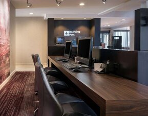 Business center with computers, printer and ergonomic chairs at Sonesta Select Los Angeles LAX El Segundo.