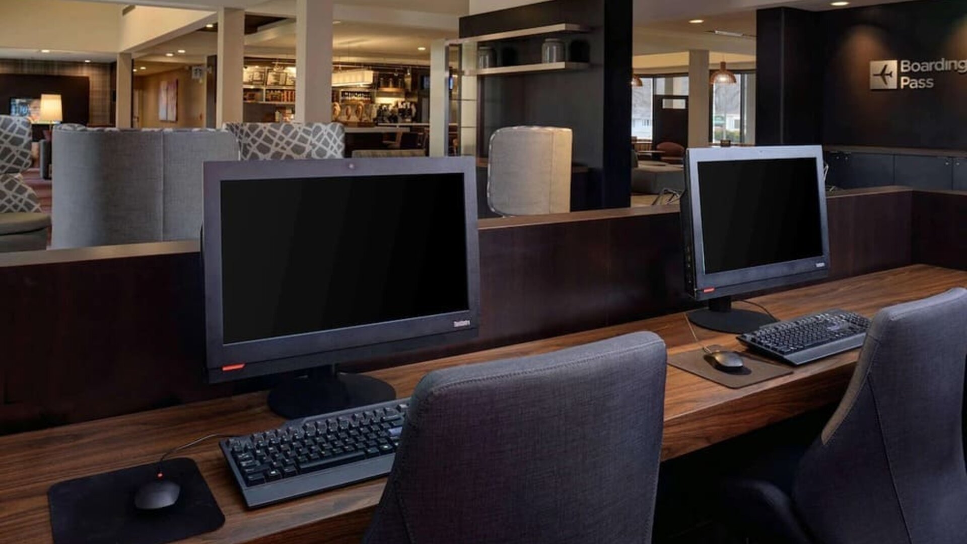Business center with computers, printer and ergonomic chair at Sonesta Select Kansas City South Overland Park.