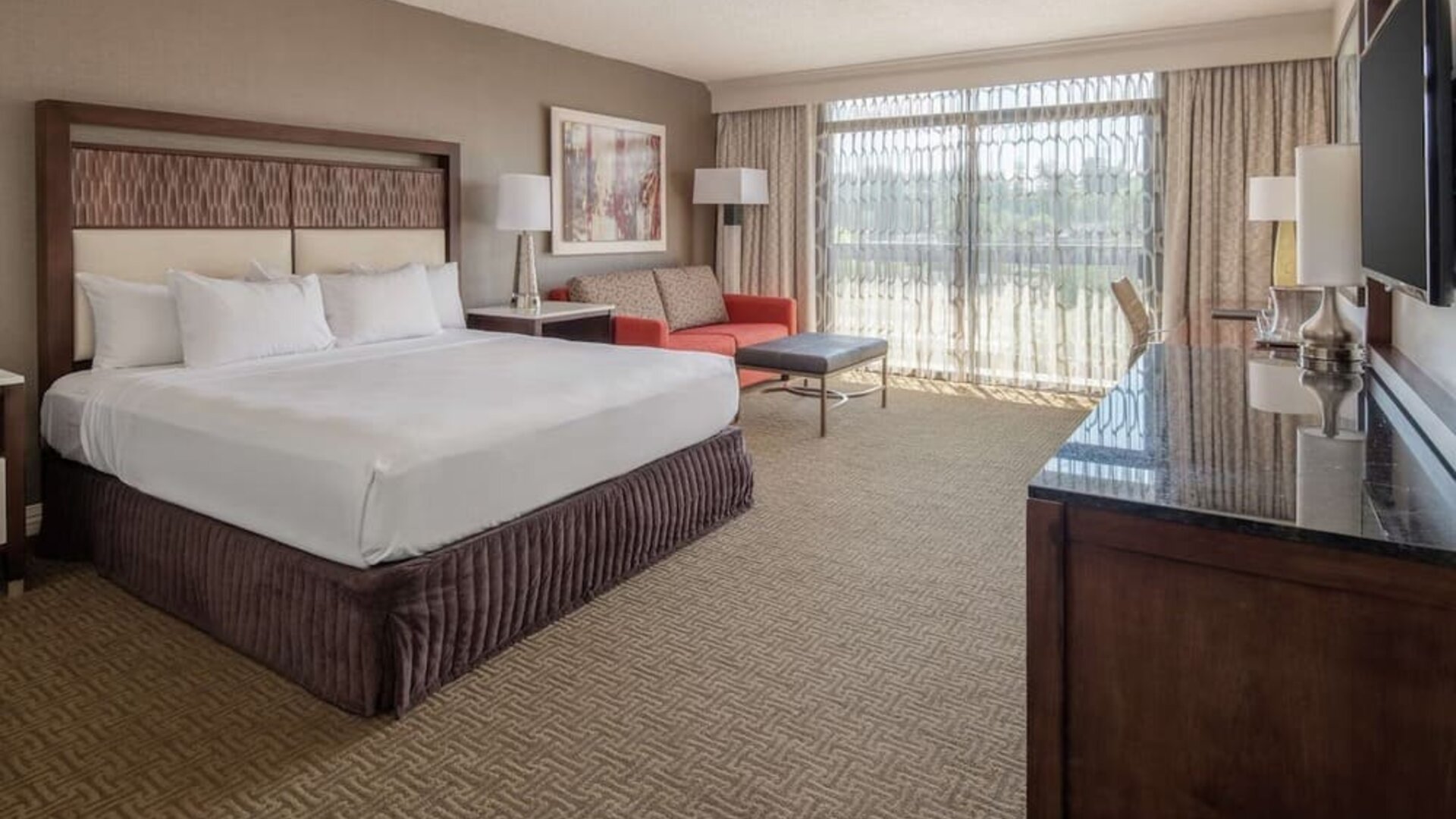 Day use room with work desk and sofa at Hilton Bellevue.