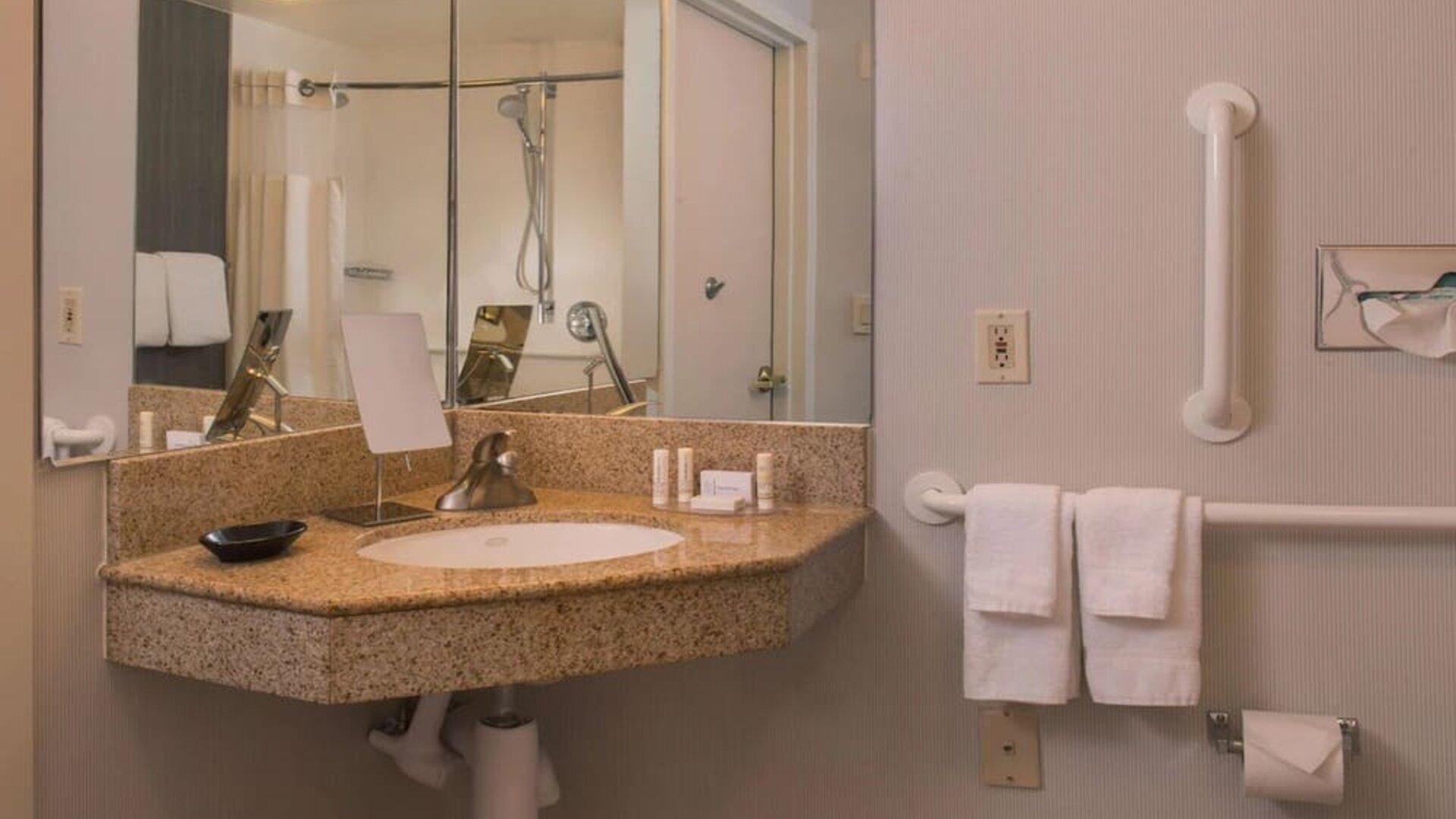 Private guest bathroom with shower and free toiletries at Sonesta Select Columbia.