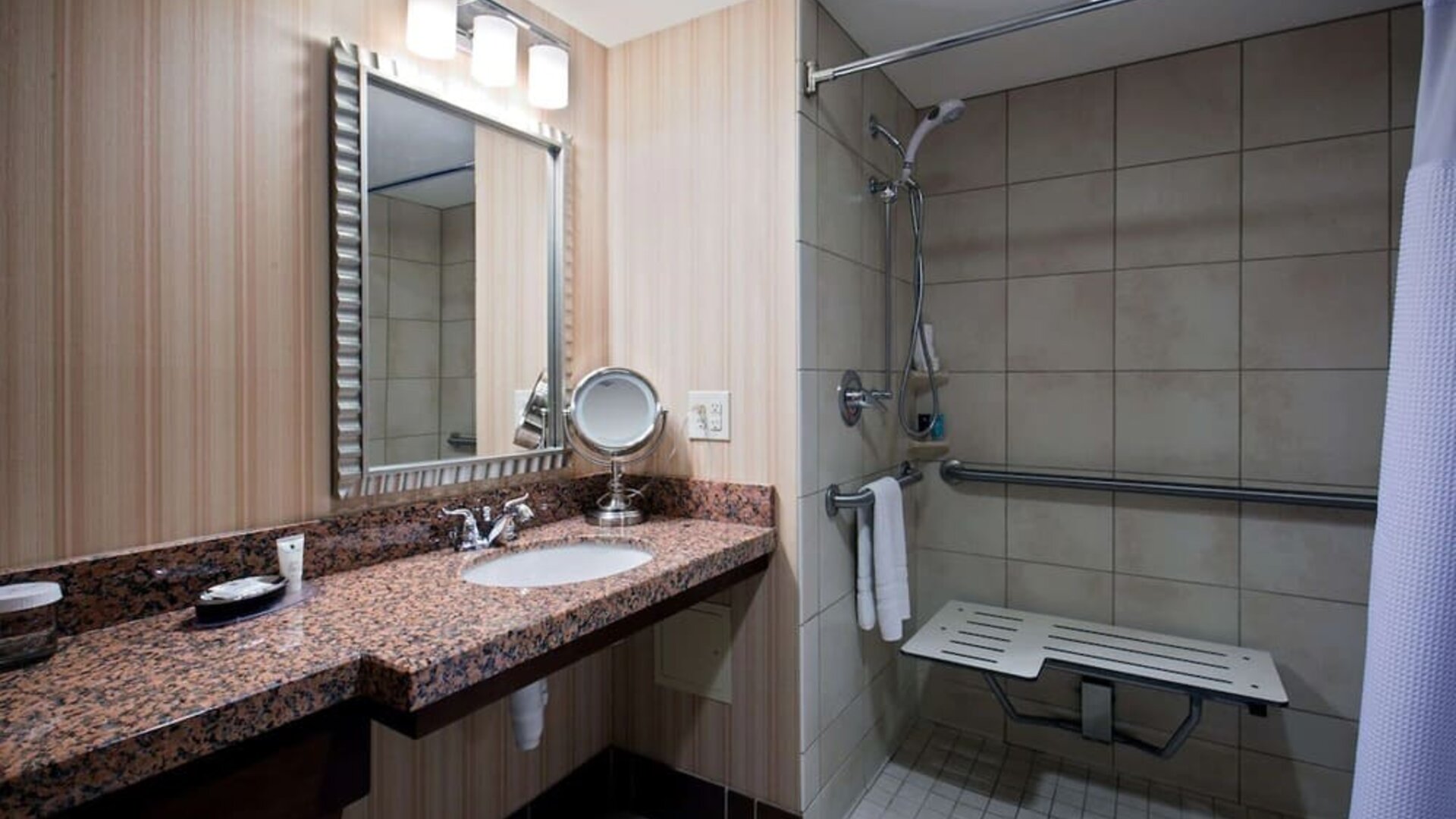 Private guest bathroom with shower at Sonesta Milwaukee West Wauwatosa.