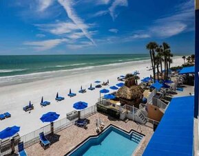 Beautiful outdoor space with pool beside the beach at DoubleTree Beach Resort By Hilton Tampa Bay - North Redington.