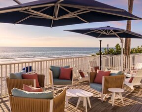 Outdoor furniture with beautiful view at DoubleTree Beach Resort By Hilton Tampa Bay - North Redington.