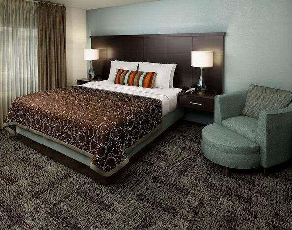 Bright and spacious day use room with sofa at Sonesta ES Suites Dallas Las Colinas.