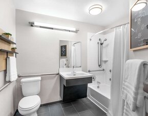 Private guest bathroom at Sonesta Simply Suites Austin South.