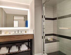 Guest bathroom with shower at DoubleTree By Hilton Canton Downtown.