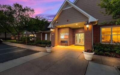 Hotel exterior and parking area at Sonesta ES Suites Parsippany Morris Plains.