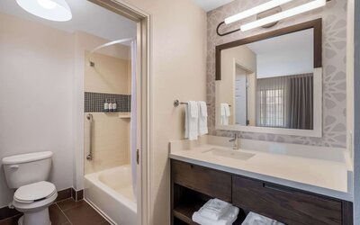 Private guest bathroom with combined shower and tub at Sonesta ES Suites Austin The Domain Area.