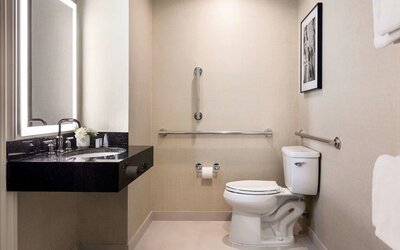 Private guest bathroom with shower at The Shelburne Sonesta New York.