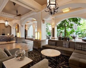 Lobby and coworking lounge at Embassy Suites By Hilton San Francisco Airport Waterfront.