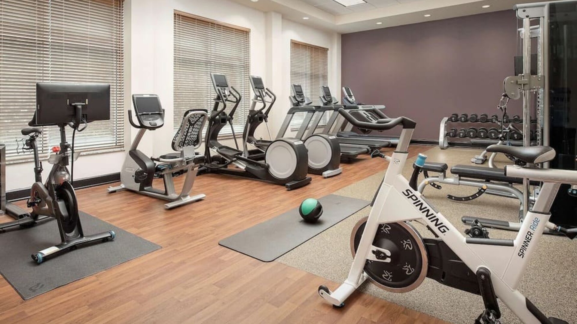 Well-equipped fitness center at Embassy Suites By Hilton Birmingham.