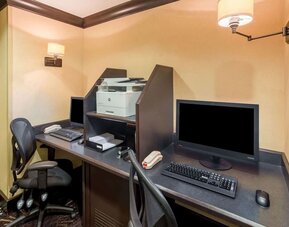 Business center with computers, printer and ergonomic chairs 	at Sonesta ES Suites Atlanta - Perimeter Center.