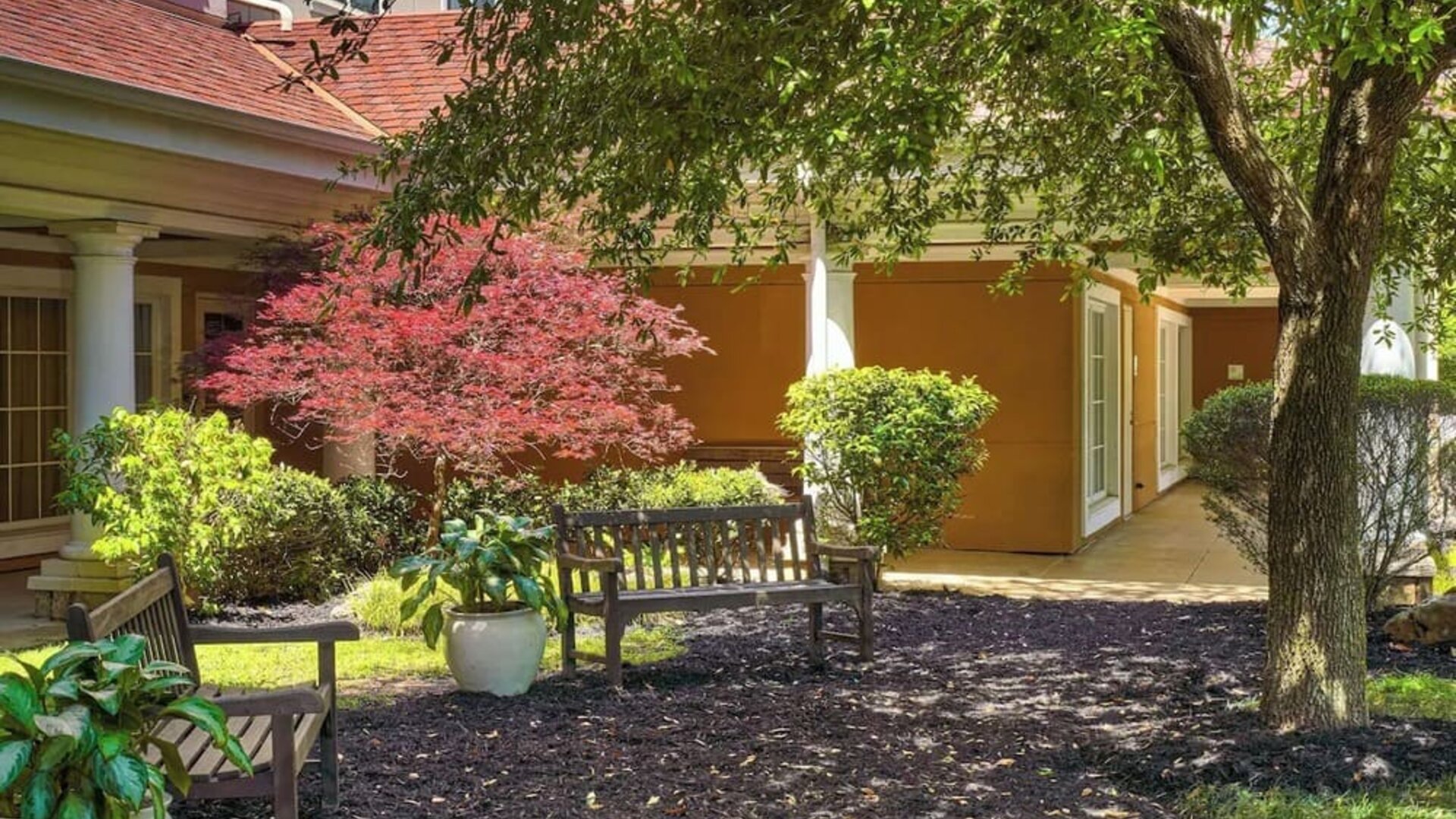 Hotel patio with lounge seating at Sonesta Atlanta Airport South.