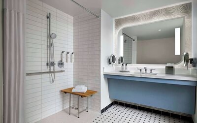 Accessible guest bathroom with shower at Sonesta Los Angeles Airport LAX.
