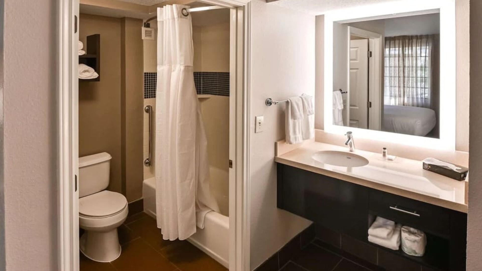 Private guest bathroom with combined shower and tub at Sonesta ES Suites San Antonio Northwest - Medical Center.