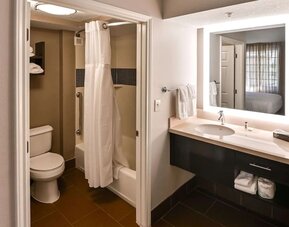 Private guest bathroom with combined shower and tub at Sonesta ES Suites San Antonio Northwest - Medical Center.