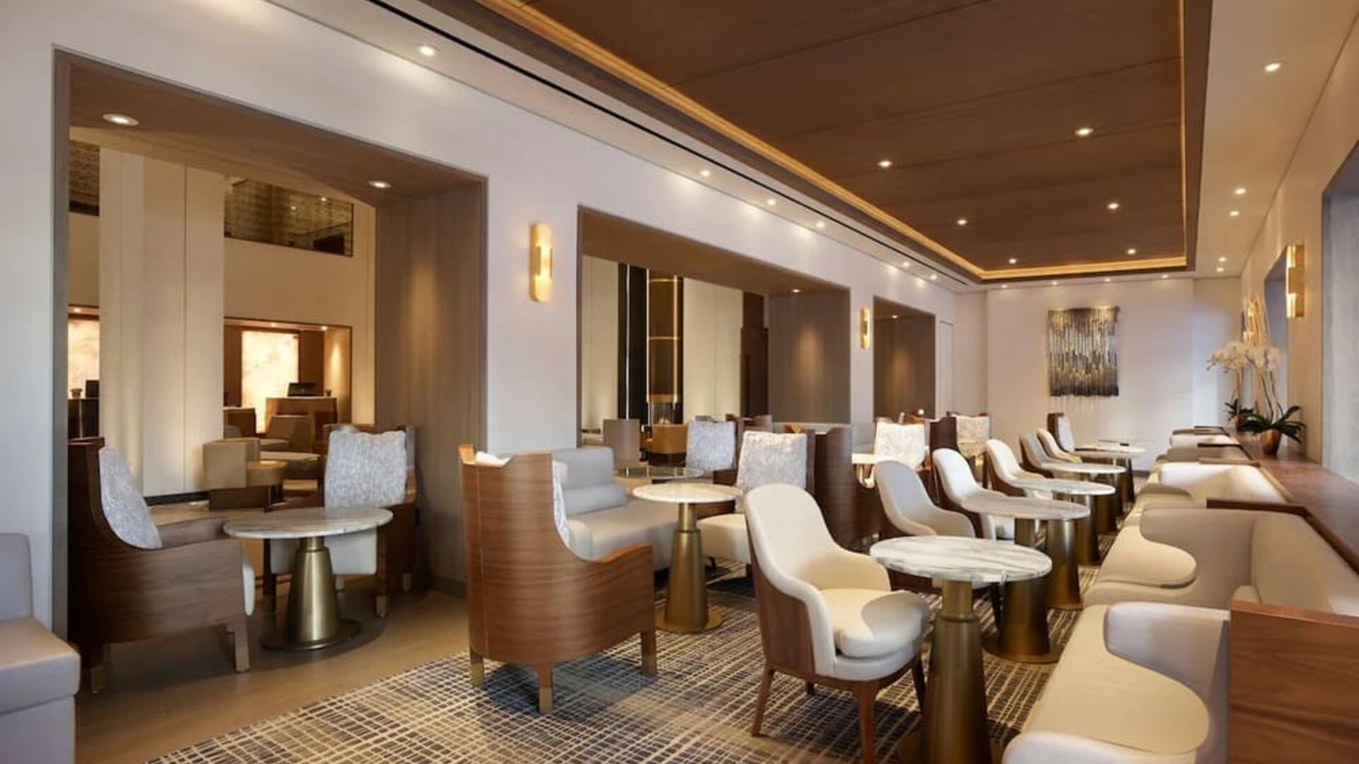 The hotel’s Living Room is furnished with comfortable seating and small tables, where guests can socialize, co-work, or have a drink.