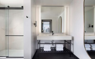 Private guest bathroom with shower at The Clift Royal Sonesta.