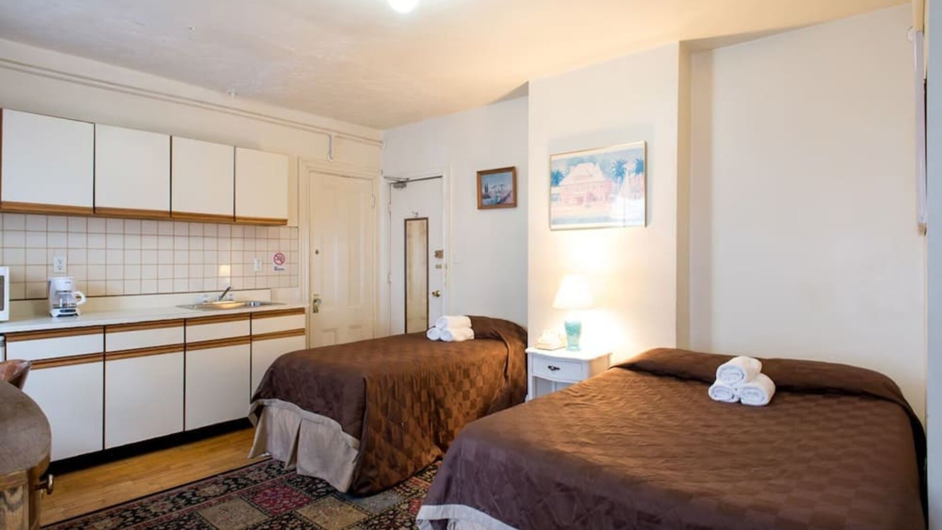 Day use twin room with in-room kitchen and work desk at The Farrington Inn.