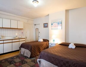Day use twin room with in-room kitchen and work desk at The Farrington Inn.