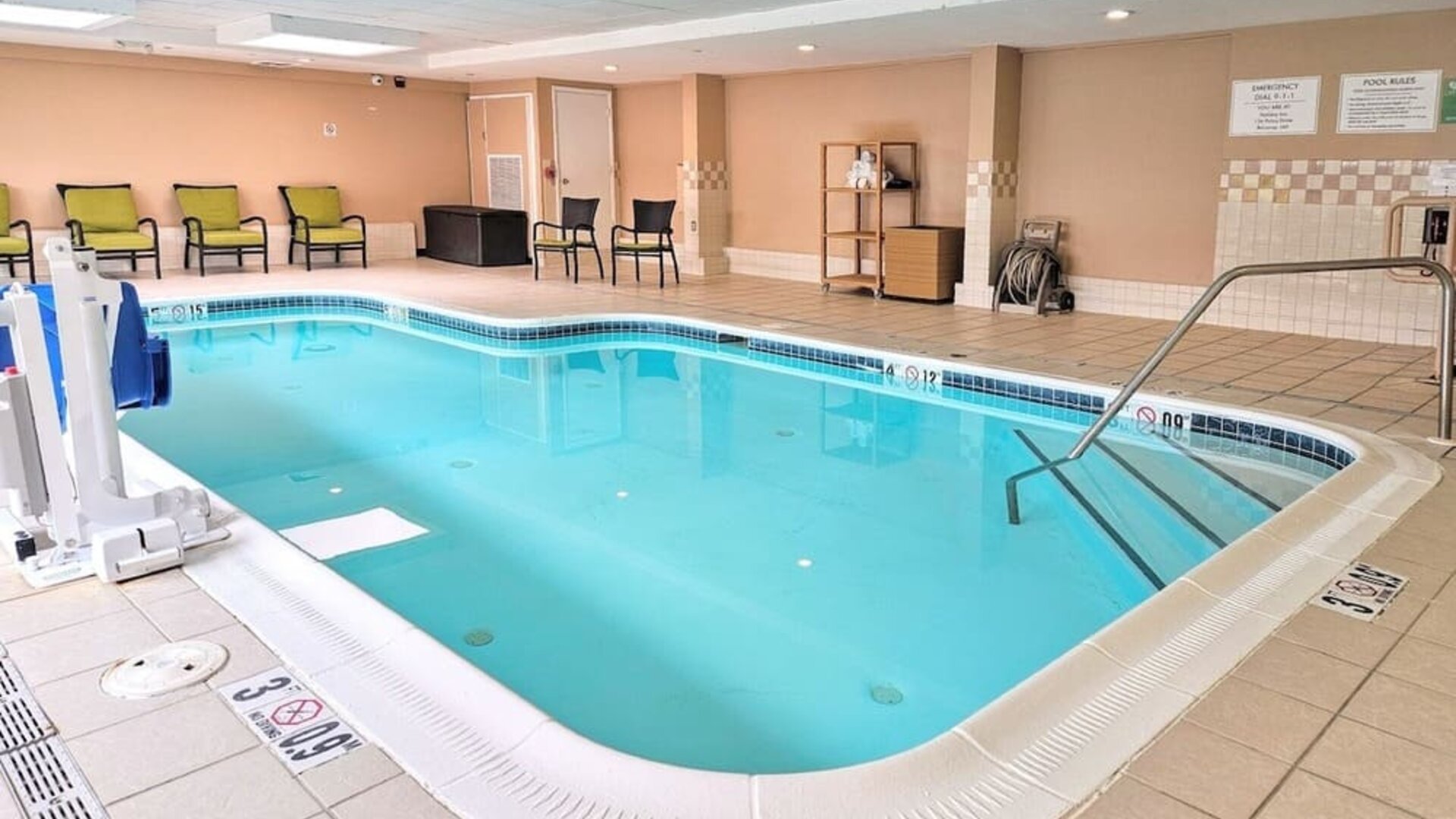 Relaxing indoor heated pool with lounge chairs at Holiday Inn Belcamp - Aberdeen Area.