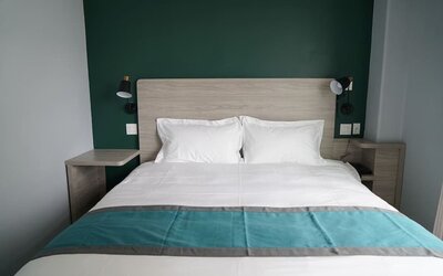 King bed at Starlight Hotel.