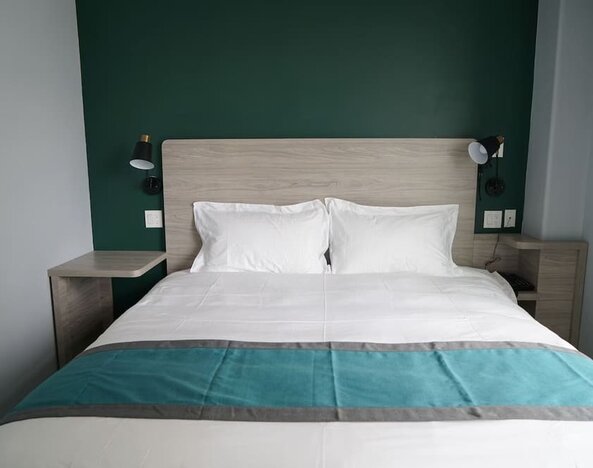 King bed at Starlight Hotel.