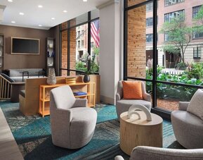 Comfortable lobby lounge and workspace at Sonesta ES Suites Chicago Downtown Magnificent Mile - Medical.