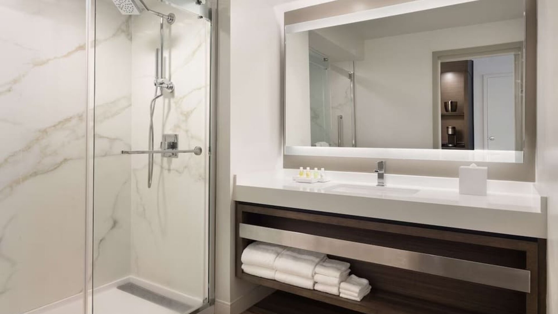 Private guest bathroom with shower and free toiletries at Royal Sonesta Kaua'i Resort Lihue.