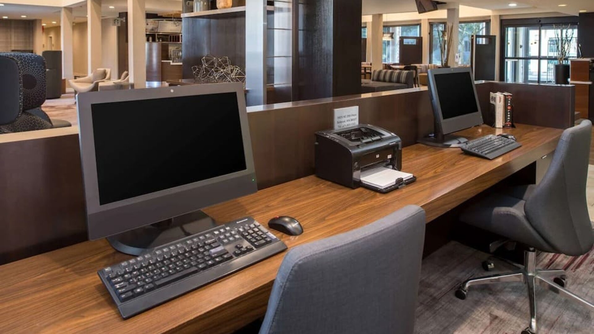 Business center with computers, printer and ergonomic chairs at Sonesta Select Seattle Bellevue Redmond.