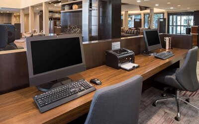 Business center with computers, printer and ergonomic chairs at Sonesta Select Seattle Bellevue Redmond.