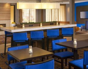 Dining area and workspace, perfect for coworking at Sonesta Select Charlotte University Research Park.