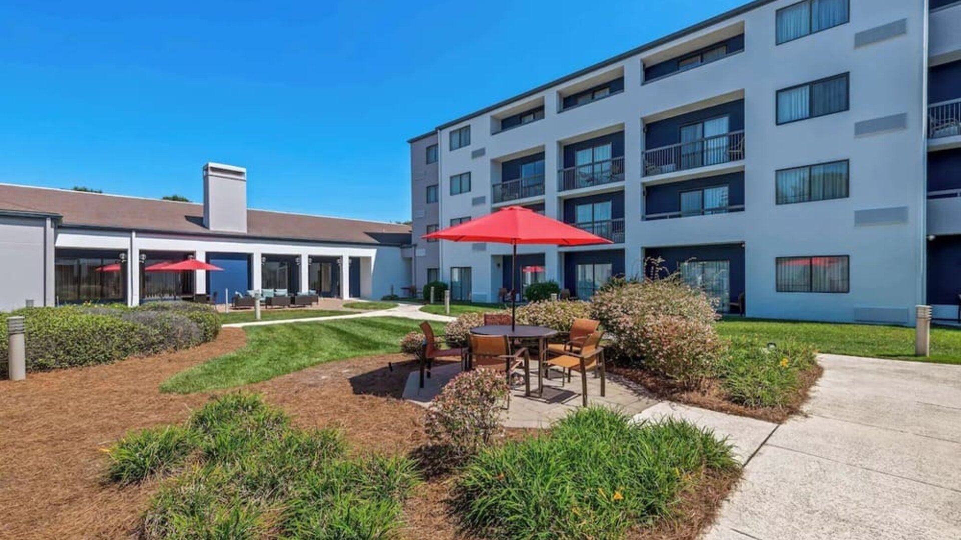 Patio and lounge seating at Sonesta Select Charlotte University Research Park.