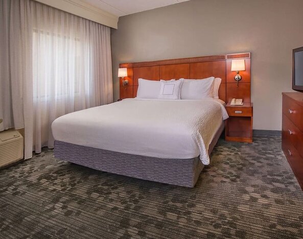 King bed at Sonesta Select Charlotte University Research Park.