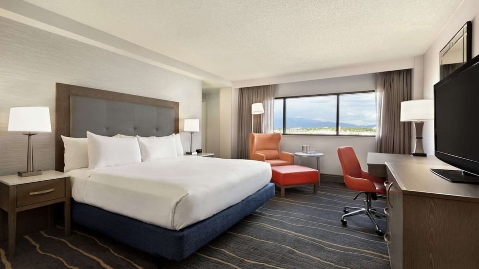 Comfortable king room with work desk and lounger at DoubleTree By Hilton Albuquerque.