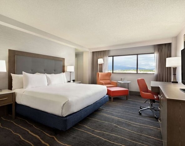 Comfortable king room with work desk and lounger at DoubleTree By Hilton Albuquerque.