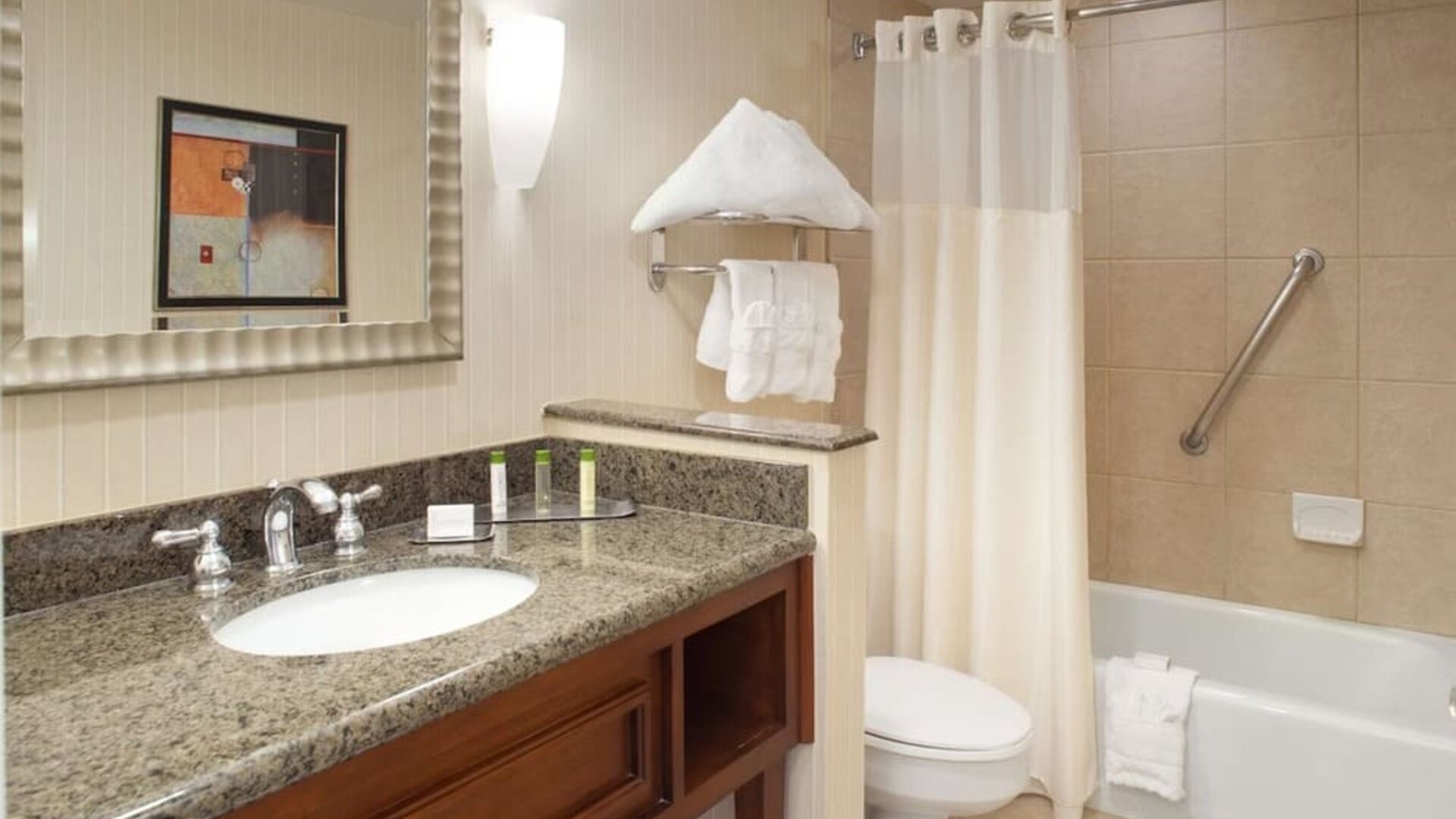 Guest bathroom with shower and tub at DoubleTree By Hilton Albuquerque.