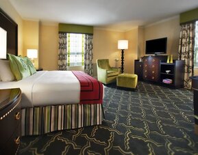Spacious king suite with work desk and lounger at Palmer House A Hilton Hotel.