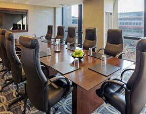 Bright-lit meeting room at Hilton Chicago O'Hare Airport.