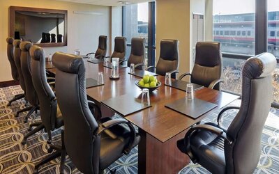 Bright-lit meeting room at Hilton Chicago O'Hare Airport.