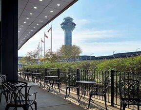 Outdoor seats at Hilton Chicago O'Hare Airport.