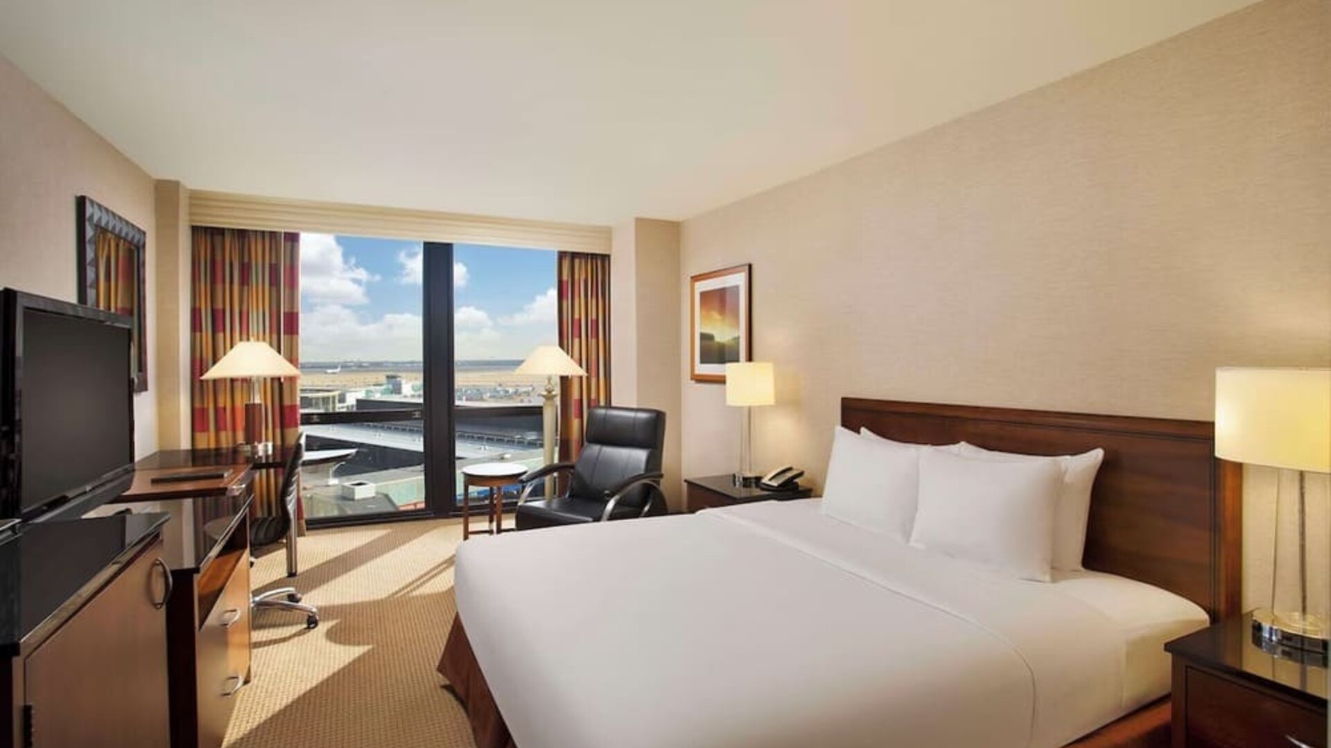Day use room with sound proofed windows and lounger at Hilton Chicago O'Hare Airport.