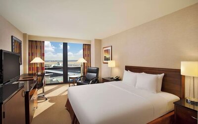 Day use room with sound proofed windows and lounger at Hilton Chicago O'Hare Airport.