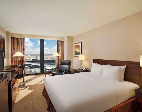 Day use room with sound proofed windows and lounger at Hilton Chicago O'Hare Airport.